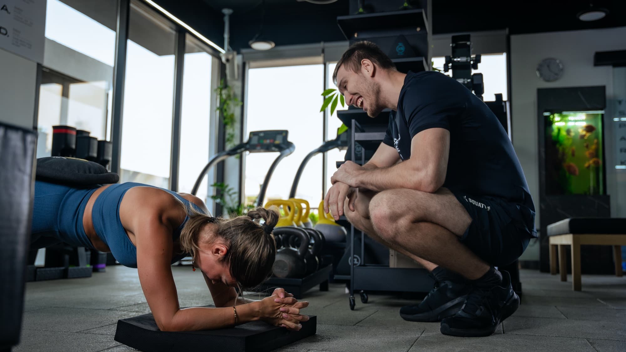 Coach correcting a plank at Youskilled