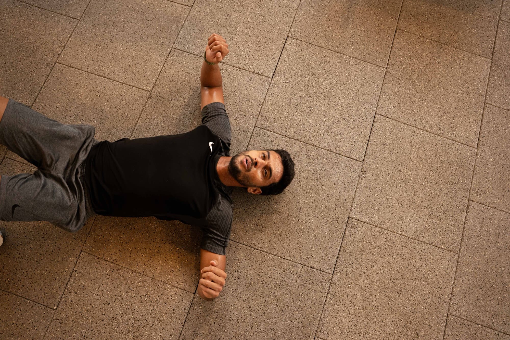 Athlete lying on the floor after a session at Youskilled