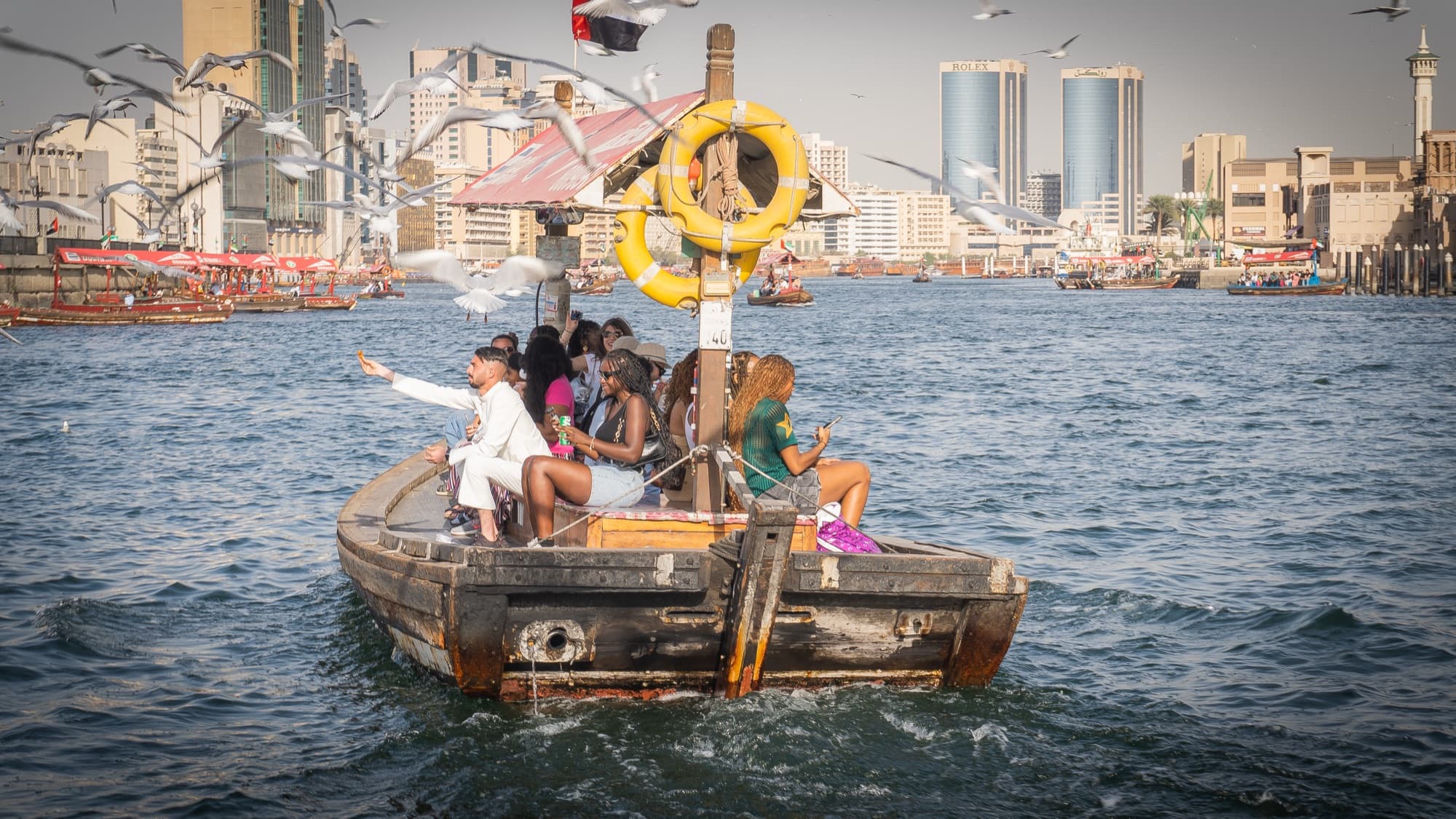Abra crossing Dubai Creek with the skyline behind
